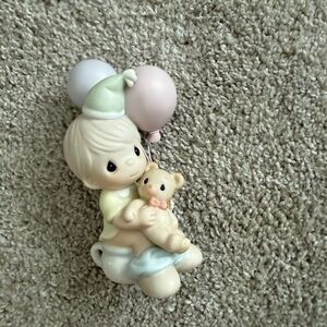This figurine is a Precious Moments "Potty Time" collectible.